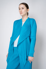 Pleats Please Issey Miyake Monthly Colors: January Drapey Lapel Cardigan in Aqua Blue Vancouver. Shop Online or in Store.