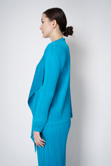 Pleats Please Issey Miyake Monthly Colors: January Drapey Lapel Cardigan in Aqua Blue Vancouver. Shop Online or in Store.