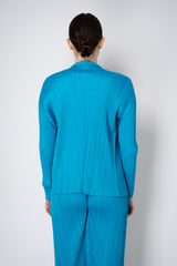 Pleats Please Issey Miyake Monthly Colors: January Drapey Lapel Cardigan in Aqua Blue Vancouver. Shop Online or in Store.