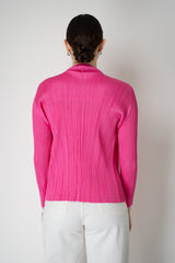 Pleats Please Issey Miyake Monthly Colors: January Drapey Lapel Cardigan in Fuchsia Vancouver. Shop Online or in Store.