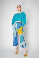 Pleats Please Issey Miyake Monthly Colors: January Rib Pleats January Cropped Bat Sleeves Cardigan in Aqua Blue Vancouver. Shop Online or in Store.