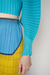 Pleats Please Issey Miyake Monthly Colors: January Rib Pleats January Cropped Bat Sleeves Cardigan in Aqua Blue Vancouver. Shop Online or in Store.