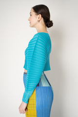 Pleats Please Issey Miyake Monthly Colors: January Rib Pleats January Cropped Bat Sleeves Cardigan in Aqua Blue Vancouver. Shop Online or in Store.