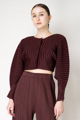 Pleats Please Issey Miyake Monthly Colors: January Rib Pleats January Cropped Bat Sleeves Cardigan in Cacao Brown Vancouver. Shop Online or in Store.