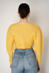 Pleats Please Issey Miyake Monthly Colors: January Rib Pleats January Cropped Bat Sleeves Cardigan in Yellow Vancouver. Shop Online or in Store.