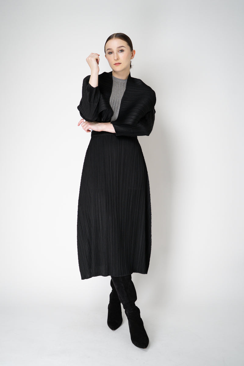 Pleats Please Issey Miyake Monthly Colors: October A-line Midi Skirt in Black Vancouver. Shop Online or in Store.