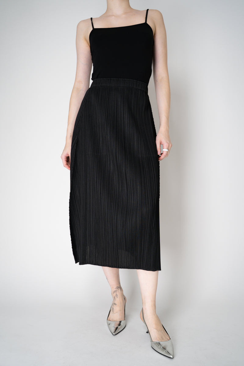 Pleats Please Issey Miyake Monthly Colors: October A-line Midi Skirt in Black Vancouver. Shop Online or in Store.