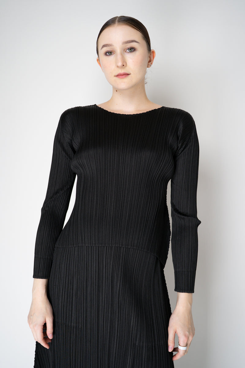 Pleats Please Issey Miyake Monthly Colors: October Round Hem Long Sleeve Top in Black Vancouver. Shop Online or in Store.