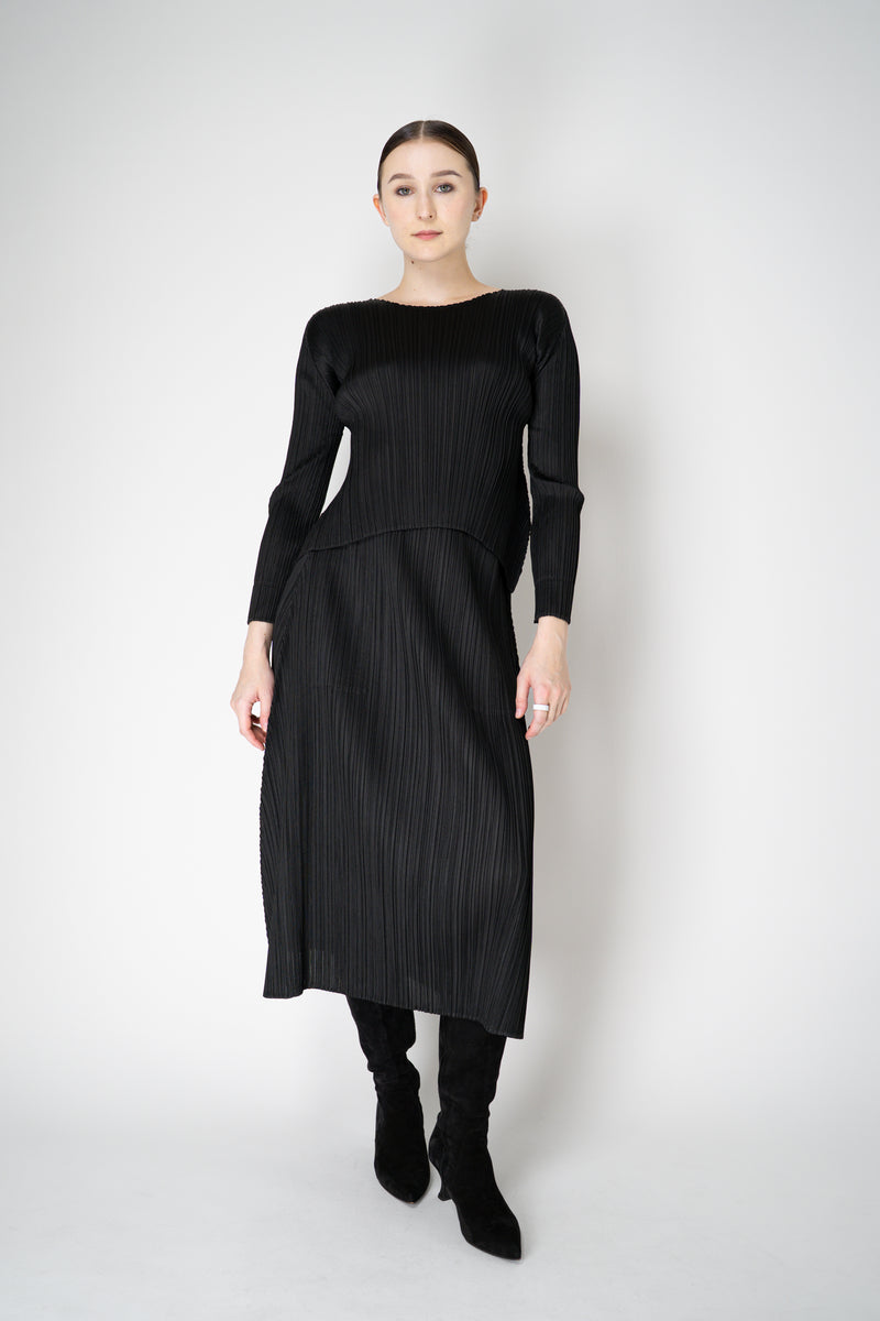 Pleats Please Issey Miyake Monthly Colors: October Round Hem Long Sleeve Top in Black Vancouver. Shop Online or in Store.