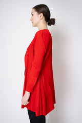 Pleats Please Issey Miyake "Olé!" Open Front Cardigan in Electric Red Vancouver. Shop Online or in Store.

