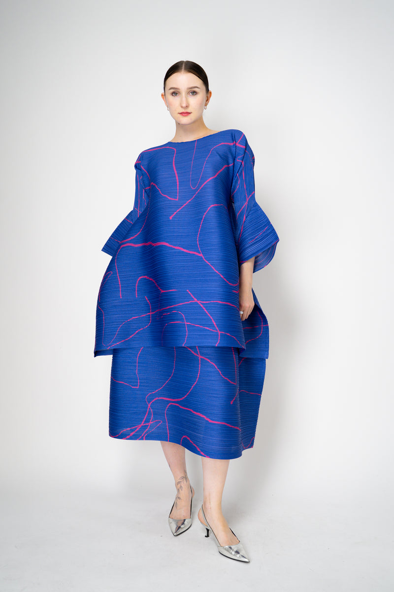 Pleats Please Issey Miyake Pause Contrasting Silhouettes Bounce Tunic Dress in Indigo and Pink Vancouver. Shop Online or in Store.