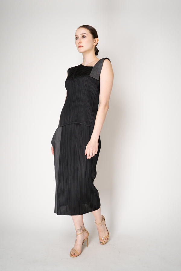 Pleats Please Issey Miyake "Pointe" Asymmetric Layered Top in Black ang Grey Vancouver. Shop Online or in Store.