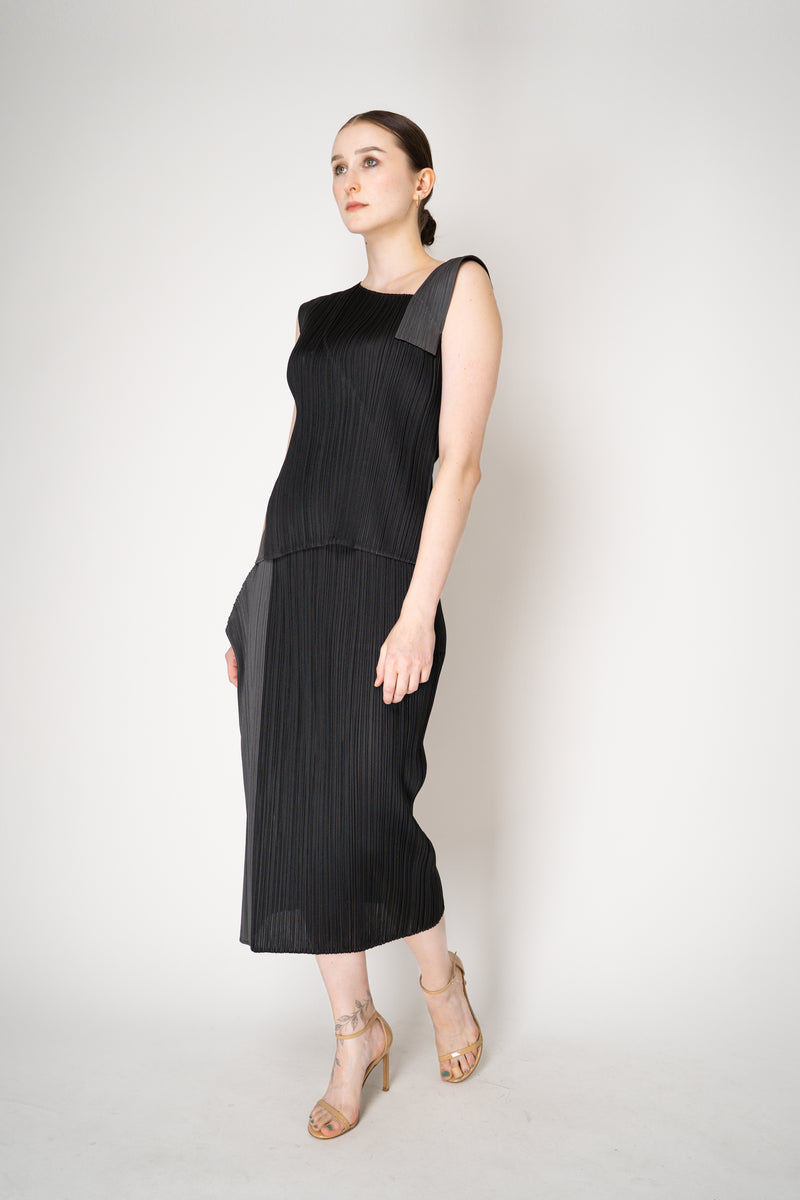 Pleats Please Issey Miyake "Pointe" Asymmetric Layered Top in Black ang Grey Vancouver. Shop Online or in Store.