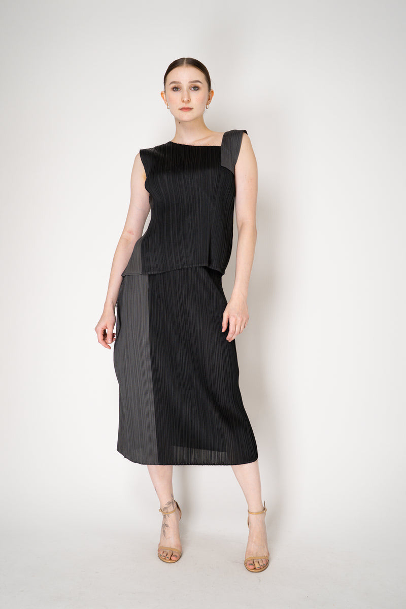 Pleats Please Issey Miyake "Pointe" Asymmetric Layered Top in Black ang Grey Vancouver. Shop Online or in Store.