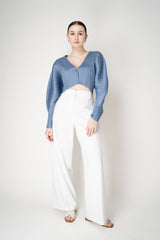Pleats Please Issey Miyake Rib Pleats December Cropped Bat Sleeves Cardigan in Icy Blue Vancouver. Shop Online or in Store.