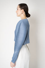 Pleats Please Issey Miyake Rib Pleats December Cropped Bat Sleeves Cardigan in Icy Blue Vancouver. Shop Online or in Store.