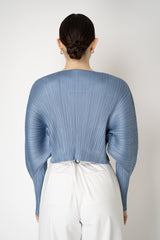 Pleats Please Issey Miyake Rib Pleats December Cropped Bat Sleeves Cardigan in Icy Blue Vancouver. Shop Online or in Store.
