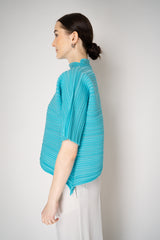 Pleats Please Issey Miyake Sheer Bounce Knit Short Sleeve Top in Turquoise Vancouver. Shop Online or in Store.