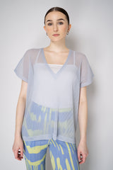 Pleats Please Issey Miyake Tatami April V-Neck Mesh Shirt in Pale Blue Vancouver. Shop Online or in Store.