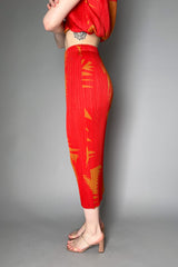 Pleats Please Issey Miyake Piquant Long Skirt in Red and Orange Pattern Vancouver. Shop Online or in Store.