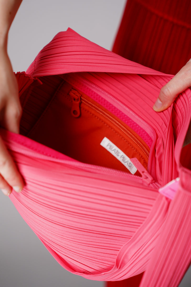 Pleats Please Issey Miyake Half Moon Bag in Neon Pink