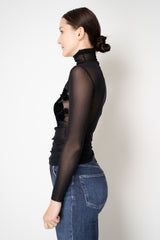 D. Exterior Stretch Tulle Turtleneck Top with Flock Chest Detail in Black