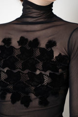 D. Exterior Stretch Tulle Turtleneck Top with Flock Chest Detail in Black