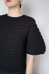 Pleats Please Issey Miyake Mushroom Knit Ribbed Top in Black Vancouver. Shop Online or in Store. 
