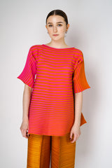 Pleats Please Issey Miyake Bounce Knit Short Sleeve Flared Top in Orange and Pink Vancouver. Shop Online or in Store.