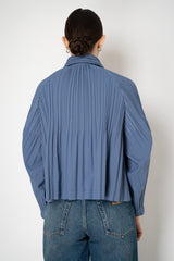 Pleats Please Issey Miyake Short Smooth Coat in Blue Grey Vancouver. Shop Online or in Store.