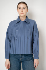 Pleats Please Issey Miyake Short Smooth Coat in Blue Grey Vancouver. Shop Online or in Store.