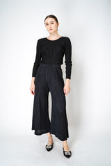 Pleats Please Issey Miyake Thicker Bottoms 2 Pants with Flared Calves in Black Vancouver. Shop Online or in Store. 
